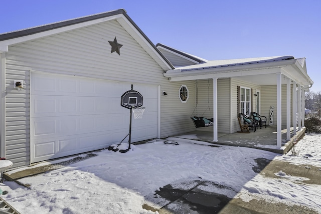 view of front of house with a porch and a garage