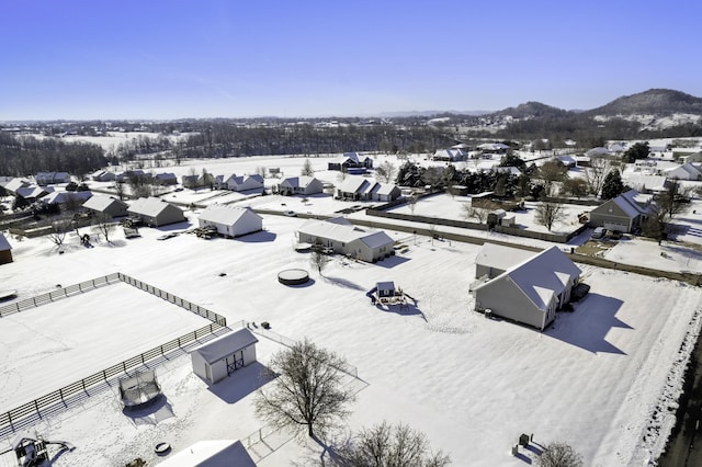 snowy aerial view with a mountain view