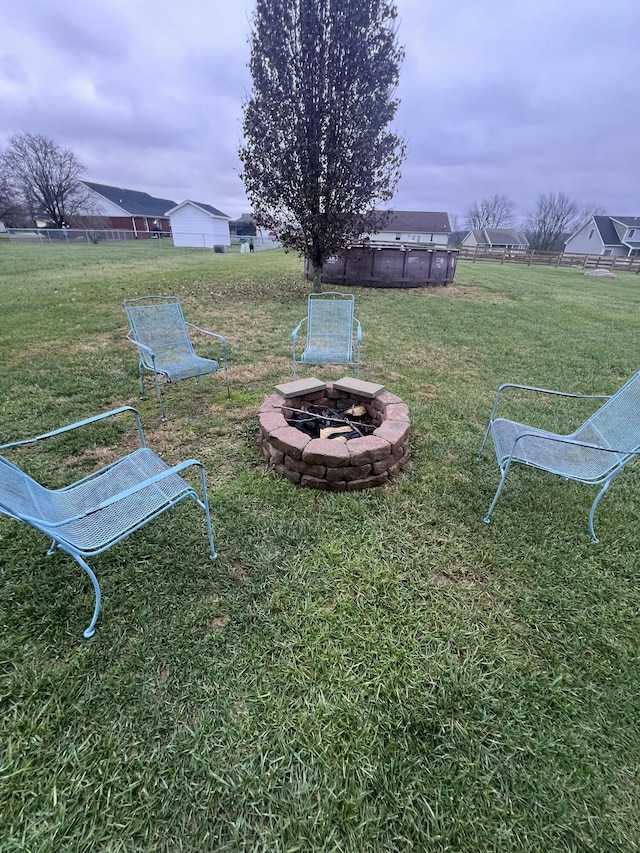 view of yard with a fire pit