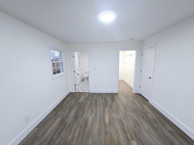 unfurnished room featuring dark hardwood / wood-style flooring