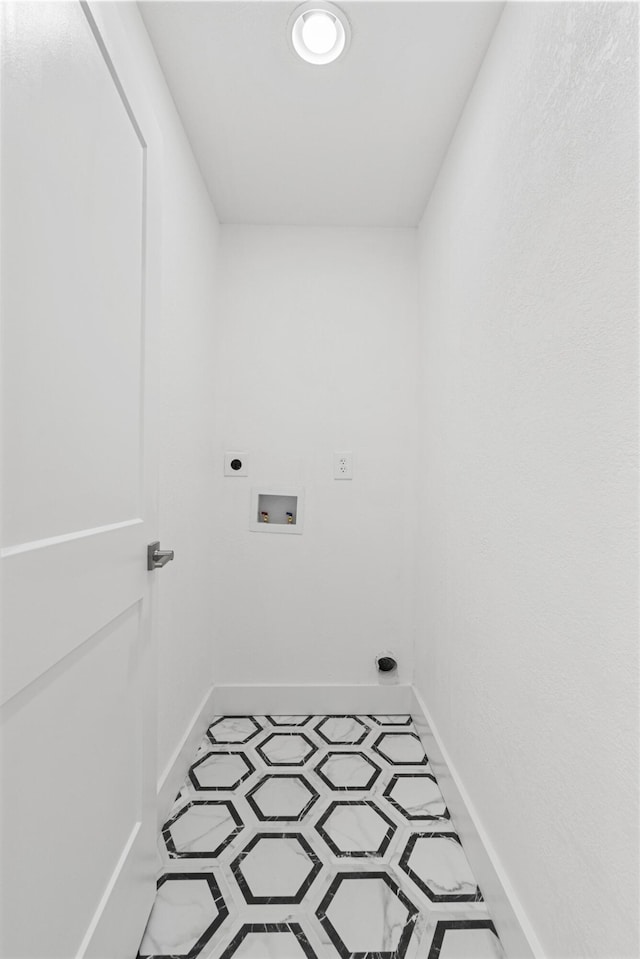 laundry room with washer hookup, electric dryer hookup, and light tile patterned floors