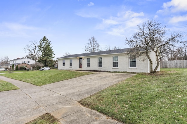 ranch-style home with a front lawn