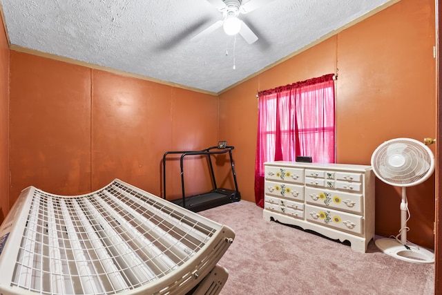 carpeted bedroom featuring a textured ceiling, vaulted ceiling, and ceiling fan