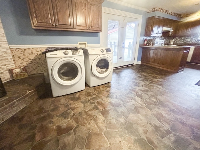 washroom with french doors, washing machine and dryer, and ornamental molding