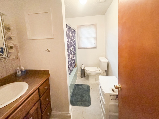 bathroom featuring tile patterned floors, vanity, and toilet