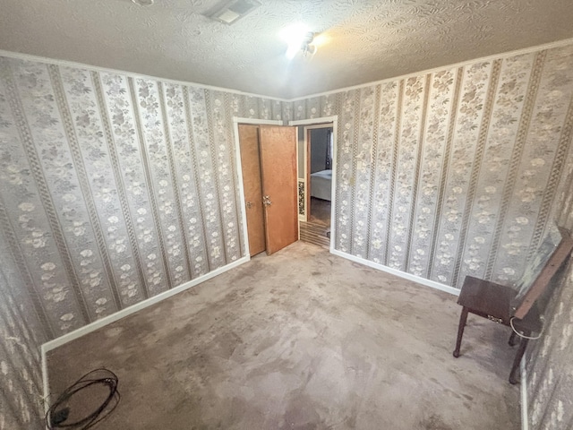 unfurnished bedroom with carpet and a textured ceiling