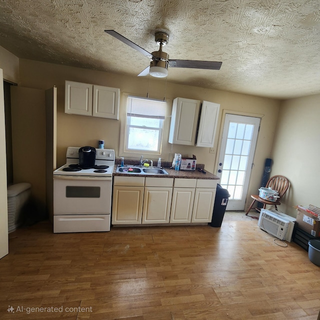 kitchen featuring sink, white cabinetry, white electric stove, ceiling fan, and light hardwood / wood-style flooring