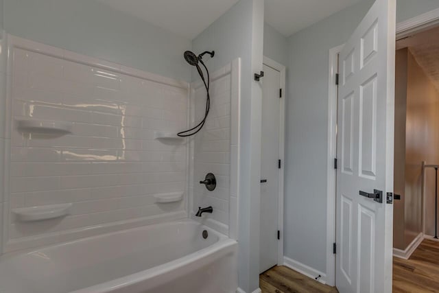 bathroom with  shower combination and hardwood / wood-style flooring