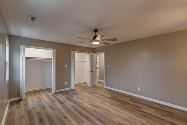 unfurnished bedroom featuring light wood-type flooring and ceiling fan