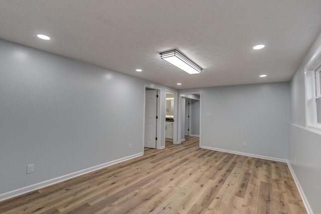 empty room with light hardwood / wood-style flooring