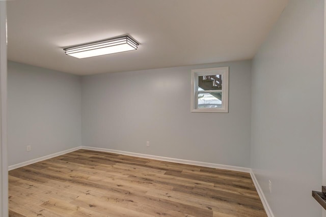 spare room with light hardwood / wood-style flooring