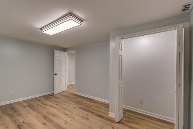 basement featuring light wood-type flooring