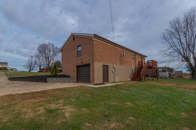 view of property exterior featuring a garage, a yard, and a wooden deck