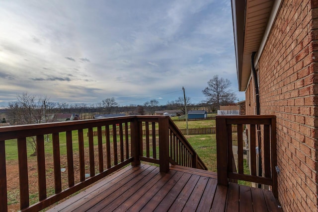 wooden deck with a lawn