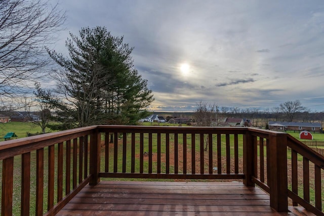 wooden deck featuring a yard