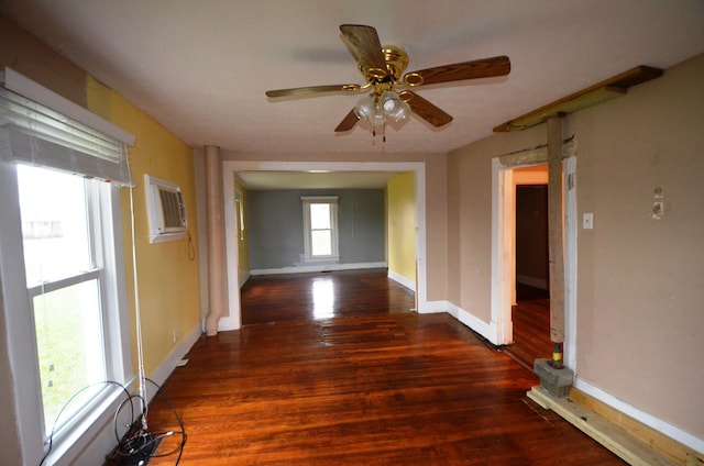 corridor featuring a wall mounted air conditioner and dark wood-type flooring