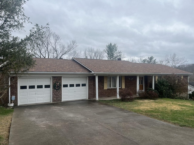 ranch-style home with a front lawn and a garage