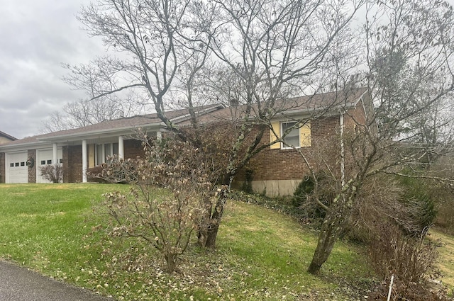 view of home's exterior with a yard