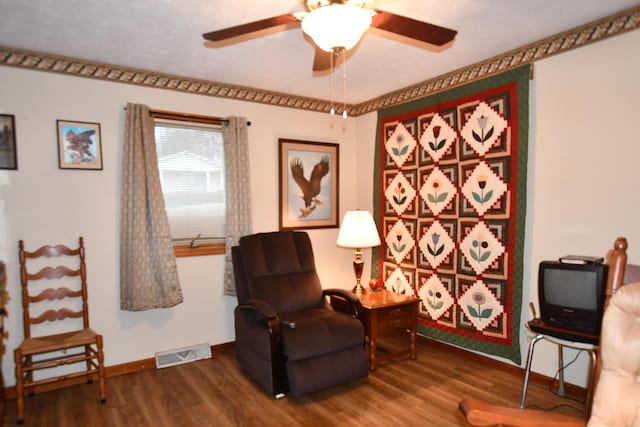 living area with ceiling fan and wood-type flooring