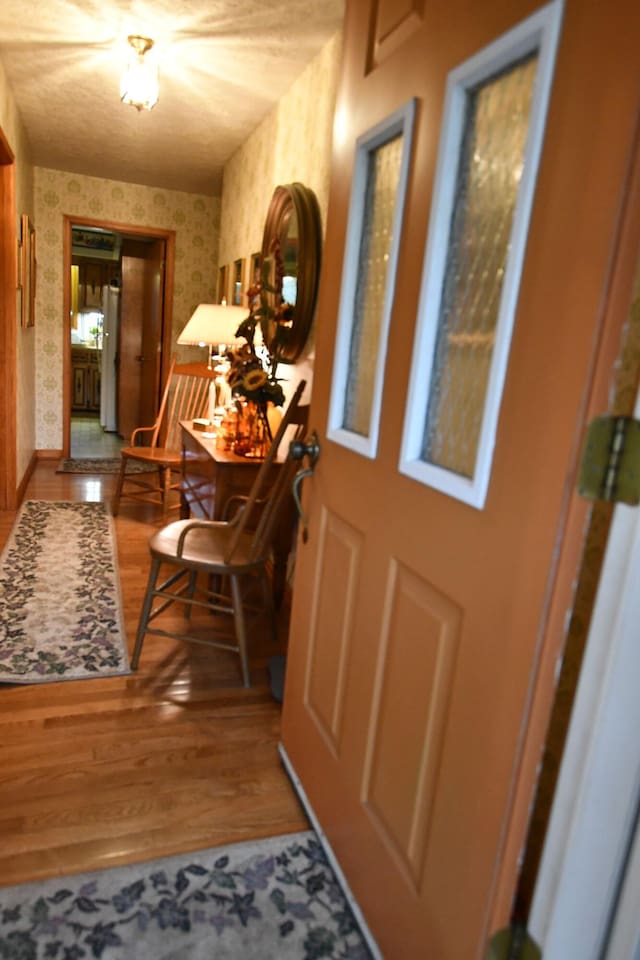 entryway with wood-type flooring