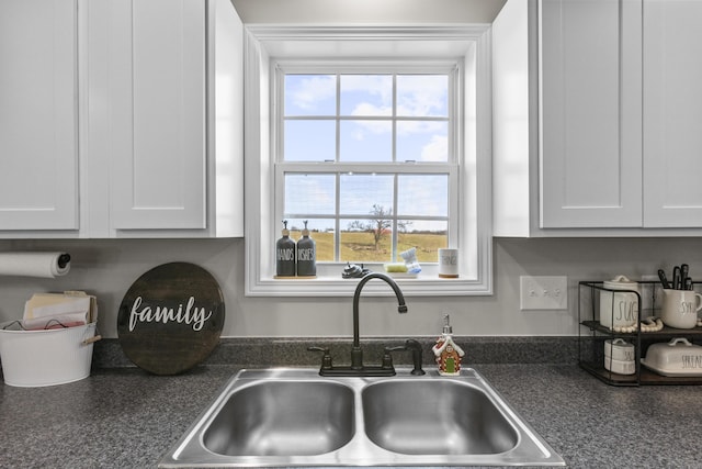 kitchen with white cabinets and sink