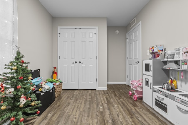 game room featuring dark hardwood / wood-style flooring