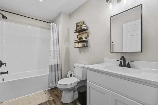 full bathroom featuring vanity, hardwood / wood-style flooring, toilet, and shower / bath combo with shower curtain