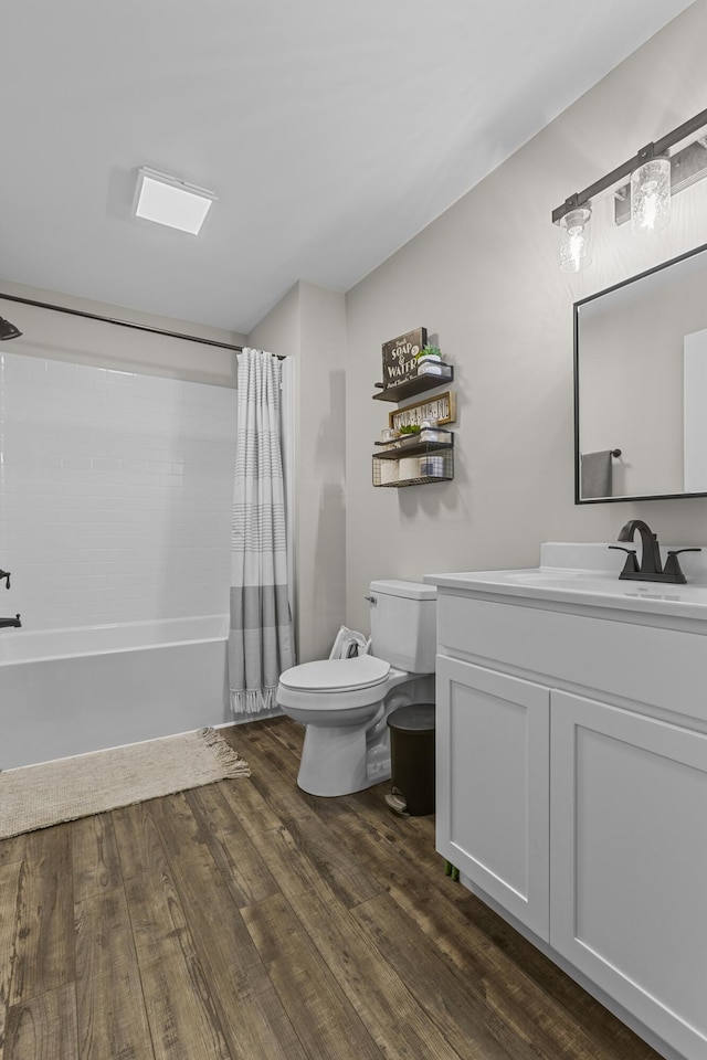 full bathroom with vanity, shower / bathtub combination with curtain, wood-type flooring, and toilet