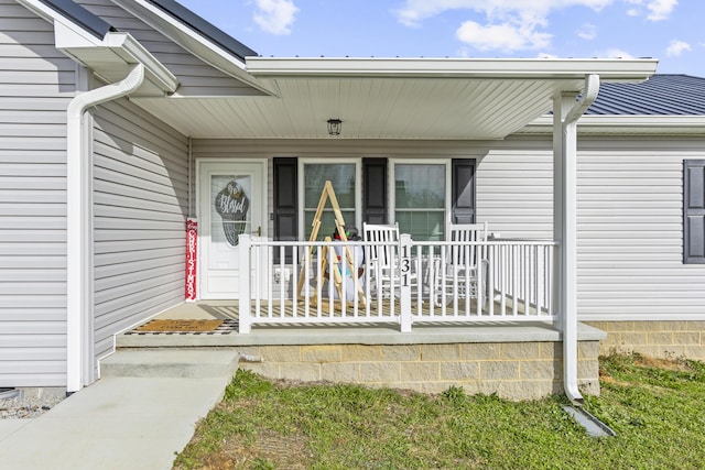 entrance to property with covered porch