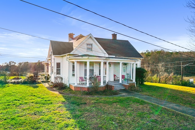 bungalow-style home featuring a front lawn and a porch