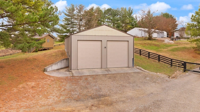 garage with a yard