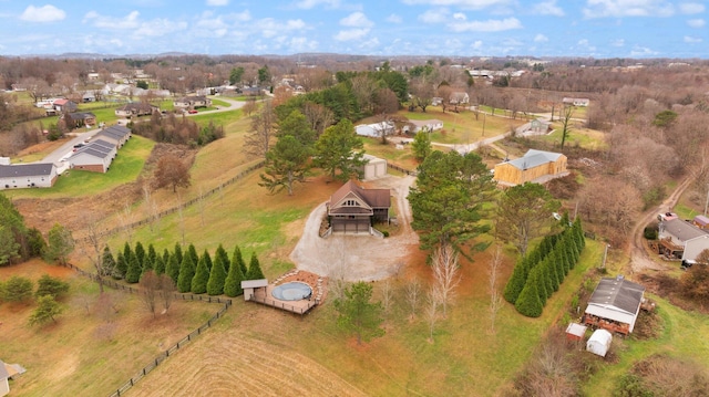 birds eye view of property featuring a rural view