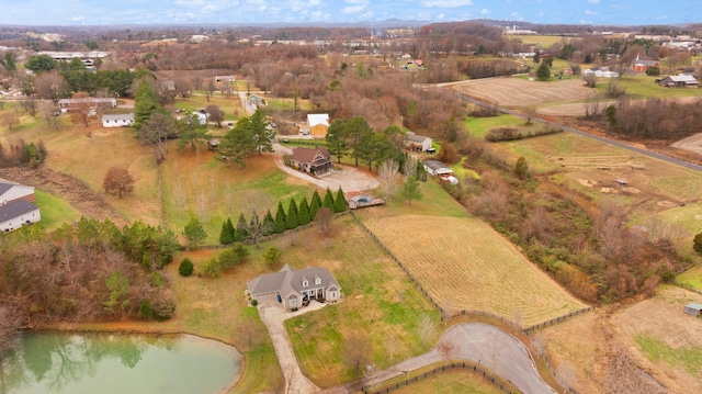 bird's eye view with a water view and a rural view