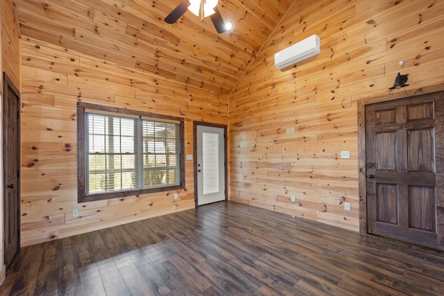 foyer entrance featuring a wall mounted air conditioner, wood walls, wood-type flooring, and high vaulted ceiling