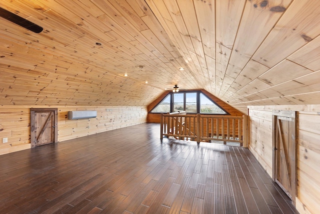 bonus room with dark hardwood / wood-style floors, wooden walls, wood ceiling, and lofted ceiling with skylight