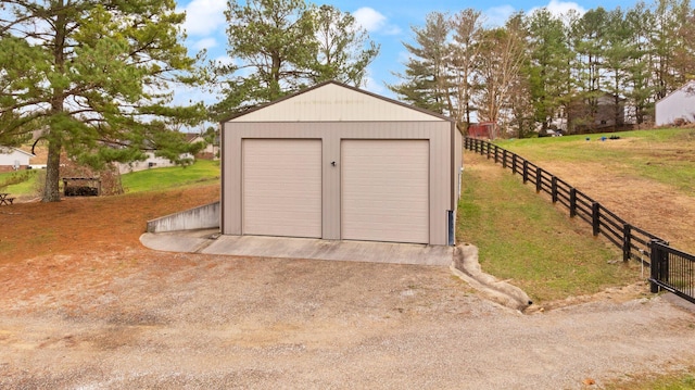 garage featuring a lawn