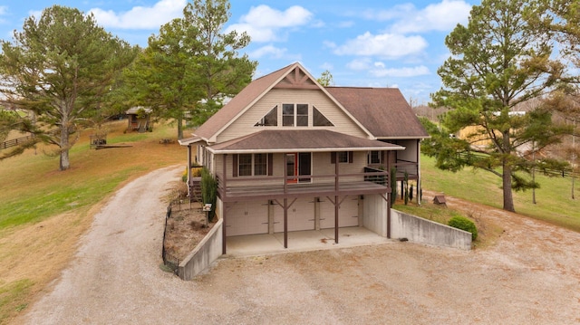 view of front facade featuring a garage and a front lawn