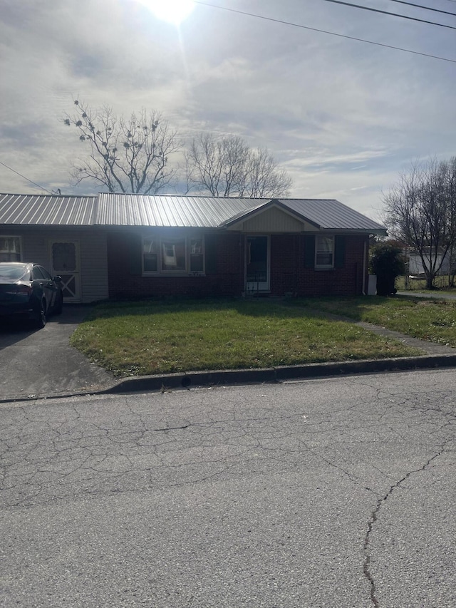 ranch-style house with a front lawn