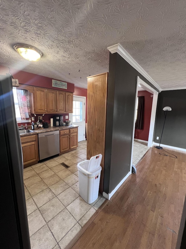 kitchen with sink, dishwasher, refrigerator, light hardwood / wood-style floors, and ornamental molding