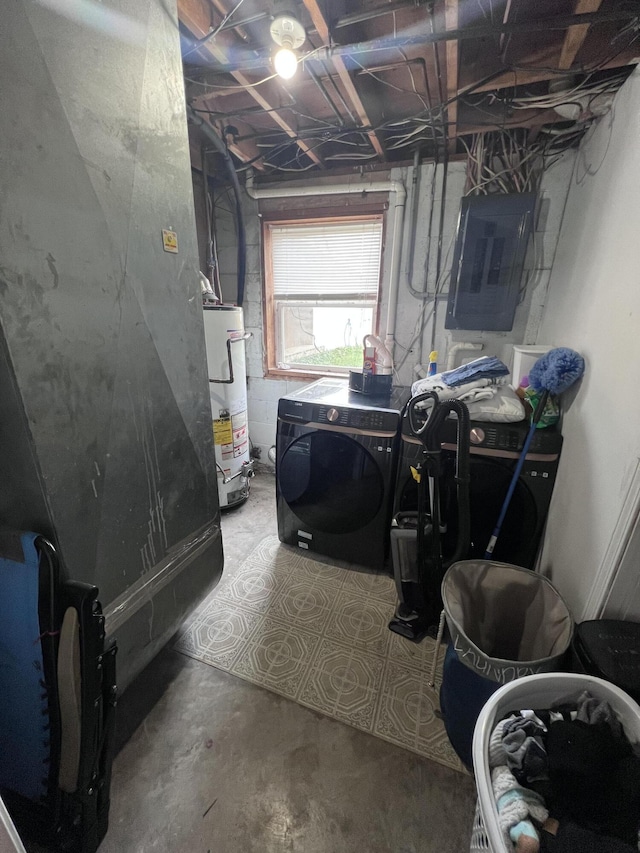 clothes washing area with independent washer and dryer, electric panel, and water heater