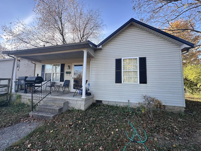 back of property featuring a porch