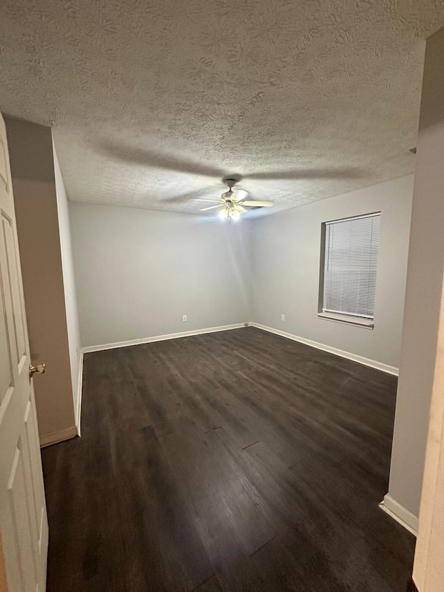 unfurnished room with dark hardwood / wood-style flooring, a textured ceiling, and ceiling fan