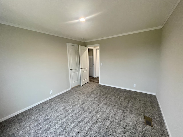 carpeted spare room with ornamental molding
