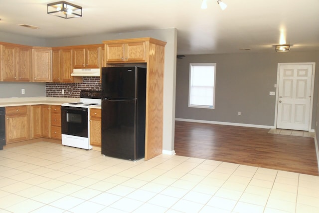 1024 Brooklyn Blvd Unit 1-4, Berea, KY 40403 - kitchen featuring freestanding refrigerator, electric stove, under cabinet range hood, light countertops, and open floor plan
