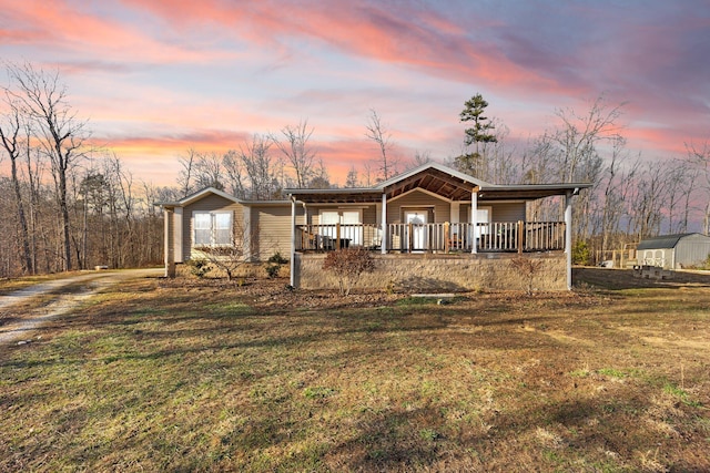 view of front facade featuring a yard and covered porch