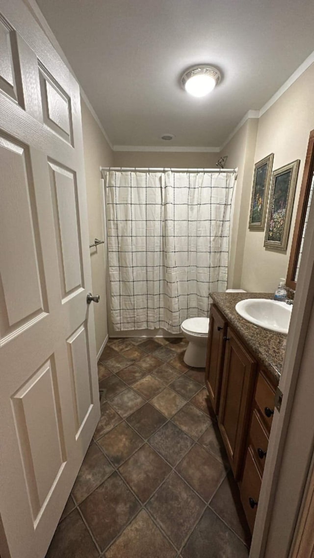 bathroom with ornamental molding, toilet, a shower with shower curtain, and vanity