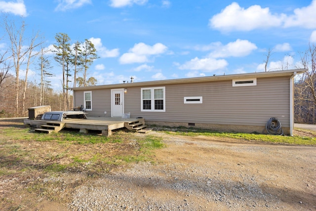 rear view of property with a deck