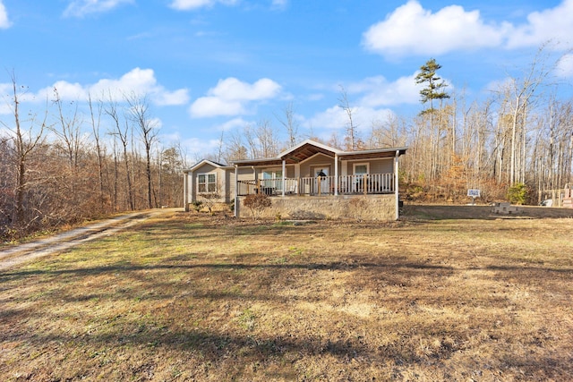 view of front of house with covered porch and a front yard