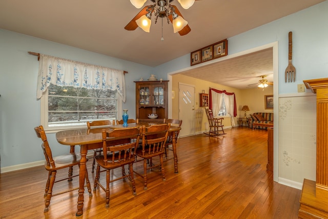 dining area featuring ceiling fan and hardwood / wood-style flooring