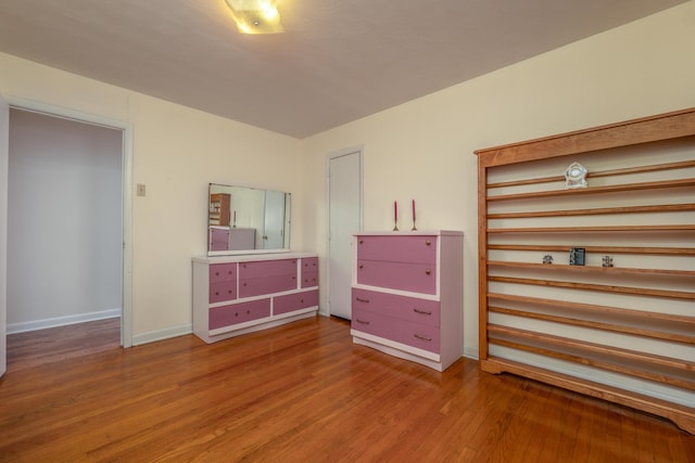 unfurnished bedroom with wood-type flooring